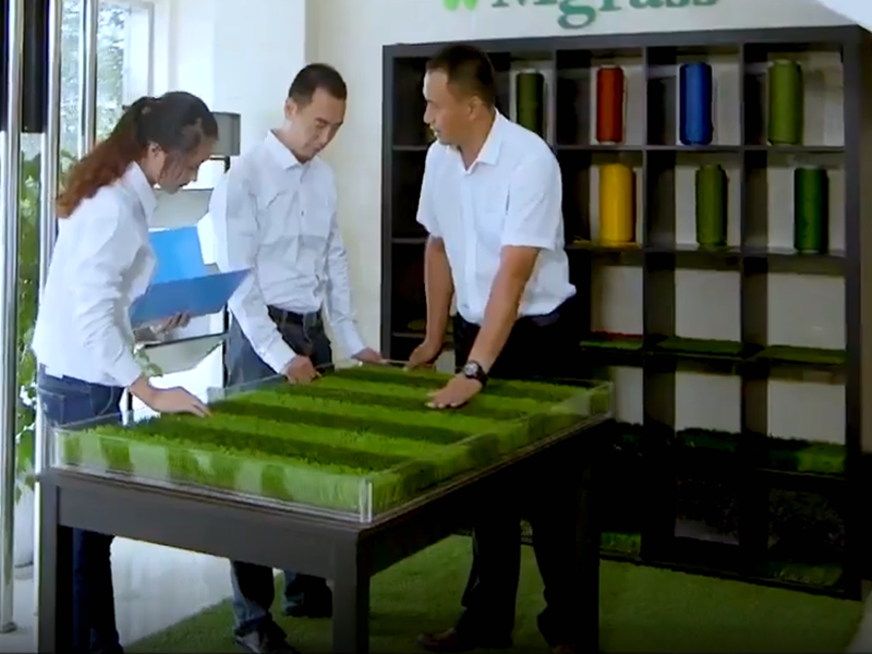 Sales people study the lawn